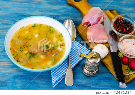 Hot vegetable soup with chicken meat Hot vegetable soup with chicken meat 42471234