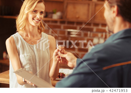 Charming female person taking pen 42471953