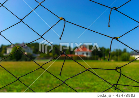 The house is behind a torn netting 42473982