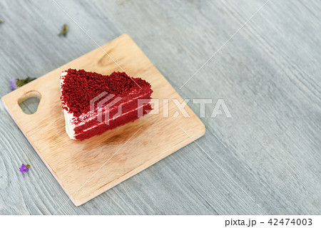 Delicious Red velvet slice cake on wood board 42474003