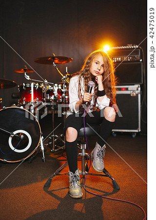 beautiful girl singing in recording studio 42475019