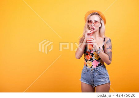Woman enjoying fresh orange juice 42475020