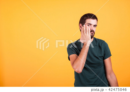 Stressed expressive man with his hands on the face 42475046