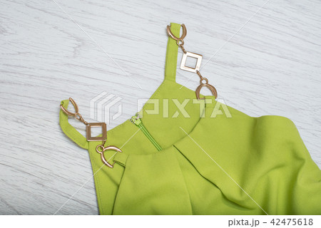 Fashionable concept. Detail of a green dress Fashionable concept. Detail of a green dress 42475618