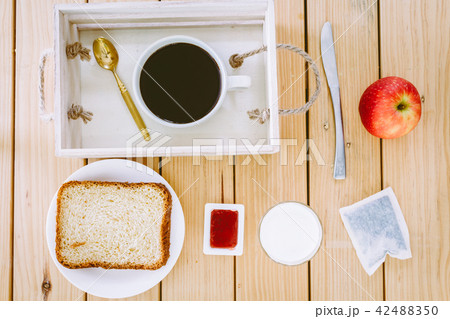 Breakfast set on wooden table Breakfast set on wooden table 42488350