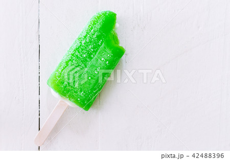 Bite Ice cream lemon on wooden background 42488396