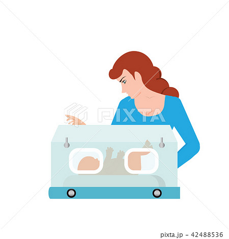 Mom or nurse look at baby in incubator. 42488536