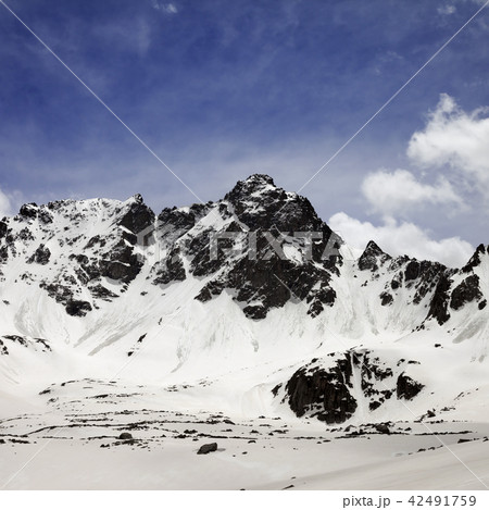 Snowy mountains with avalanches in spring Snowy mountains with avalanches in spring 42491759