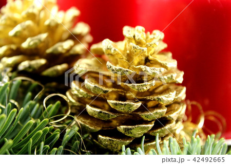 golden pine cone on a christmas decoration golden pine cone on a christmas decoration 42492665