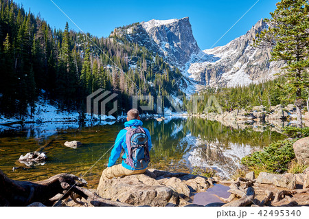 Tourist near Dream Lake in Colorado Tourist near Dream Lake in Colorado 42495340