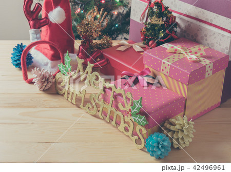 Christmas ornaments on wood table. 42496961