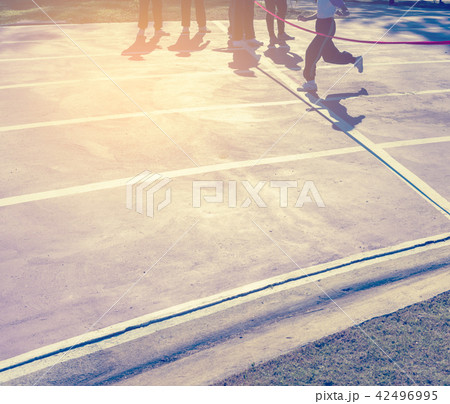 red ribbon at finish line . 42496995