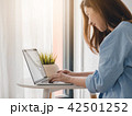 Beautiful young asian girl working at home 42501252
