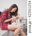 Beautiful young asian woman using smartphone 42501254