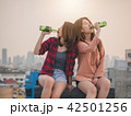 Young asian woman lesbian couple clinking bottles 42501256