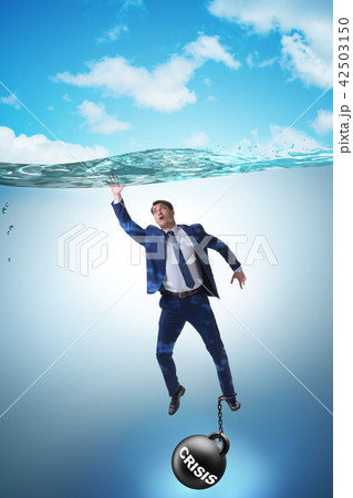 Businessman failing during crisis times Businessman failing during crisis times 42503150