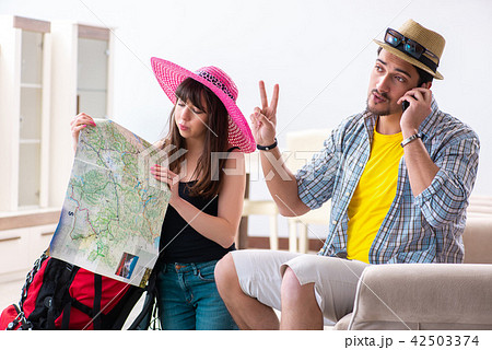 Young pair planning their honeymoon camping trip Young pair planning their honeymoon camping trip 42503374