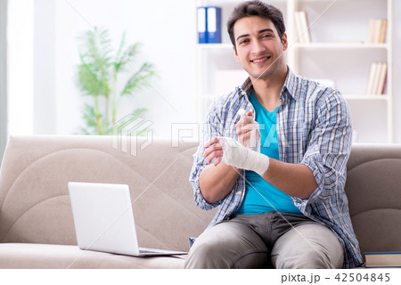 Young student man with injury at home Young student man with injury at home 42504845