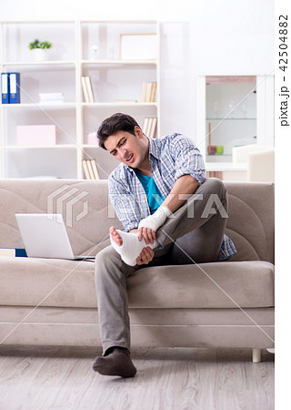 Young student man with injury at home 42504882