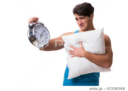 Young man with pillow isolated on white background 42506368