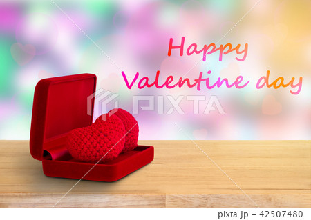 red heart in red box on wooden floor 42507480