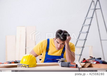 Floor repairman disappointed with his work  Floor repairman disappointed with his work  42508280