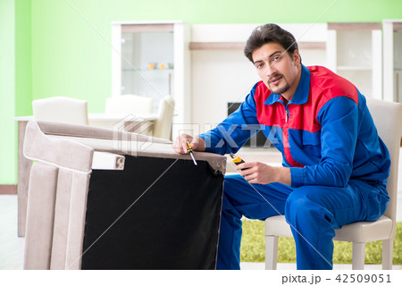 Repair contractor repairing broken furniture at home 42509051