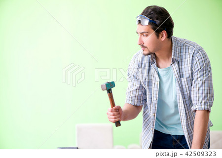 Woodworker working in his workshop 42509323