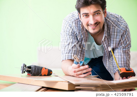 Woodworker working in his workshop 42509791