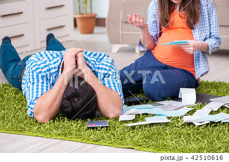Young family in budget planning concept Young family in budget planning concept 42510616
