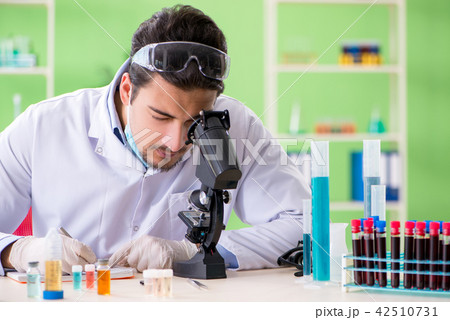Man chemist working in the lab Man chemist working in the lab 42510731