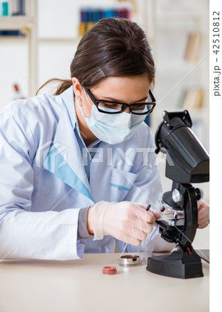 Lab chemist checking beauty and make-up products Lab chemist checking beauty and make-up products 42510812