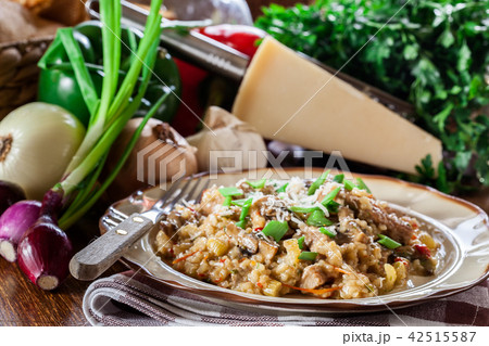 Risotto with mushrooms, pork and parmesan 42515587