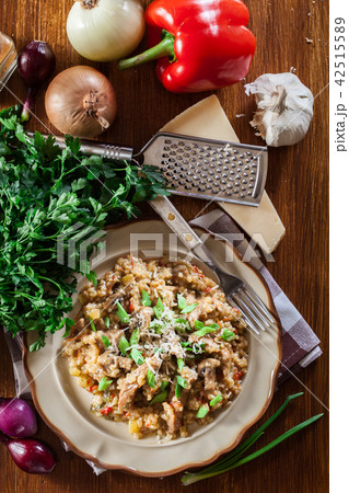 Risotto with mushrooms, pork and parmesan 42515589
