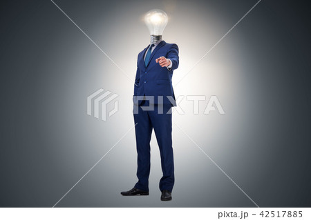 Businessman in bright idea concept with lightbulb head Businessman in bright idea concept with lightbulb head 42517885