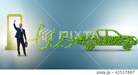 Businessman with car powered with biofuel 42517897