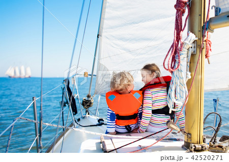 Kids sail on yacht in sea. Child sailing on boat. 42520271