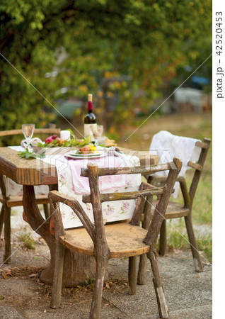 Lunch is romantic in autumn garden, atmosphere of holiday and coziness. Autumnal dinner in the open 42520453