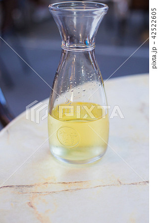 White wine in a liter bottle on a table in a cafe 42522605