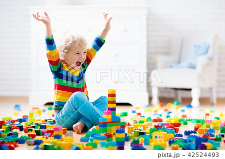 Child playing with toy blocks. Toys for kids. Child playing with toy blocks. Toys for kids. 42524493