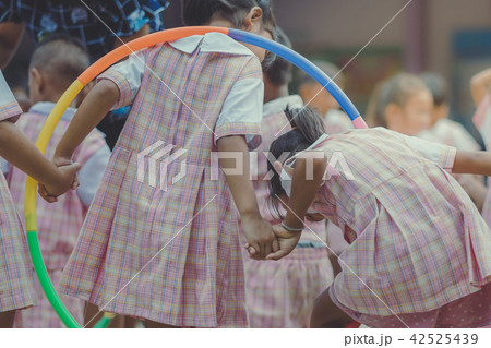 Young Kids exercise with hoola hoop Young Kids exercise with hoola hoop 42525439