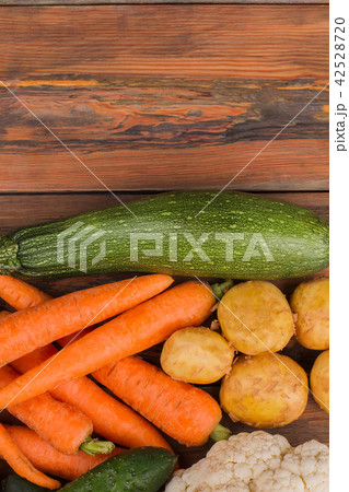 Different vegetables on wood. 42528720