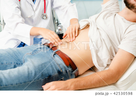 Woman Doctor and Male Patient in Hospital Office Woman Doctor and Male Patient in Hospital Office 42530598