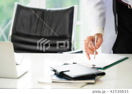 Young man doctor working at office in hospital. 42530635