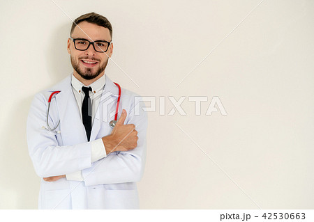 Doctor showing thumbs up on white background. Doctor showing thumbs up on white background. 42530663