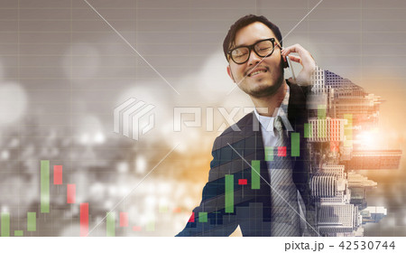 Double exposure businessman using mobile phone. 42530744