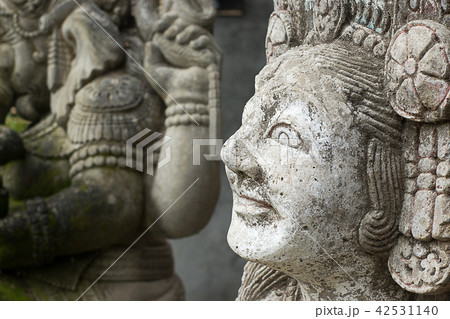 Ancient balinese woman sculpture. Close up face. Ancient balinese woman sculpture. Close up face. 42531140