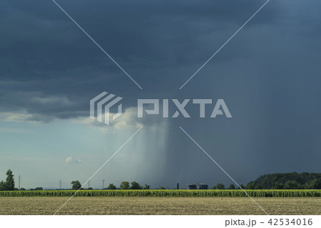 Storm front with rain and blue sky. Storm front with rain and blue sky. 42534016