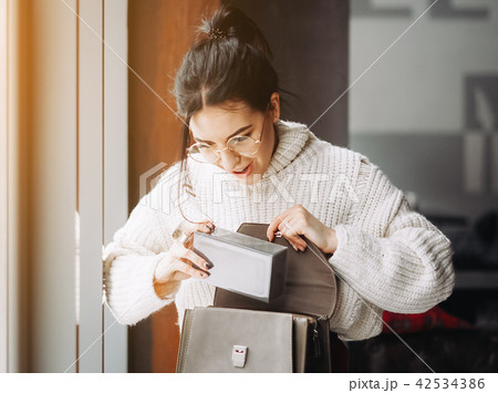 Fashionable woman hold black bag 42534386