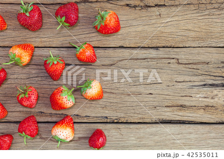 strawberries on the old wooden table background. strawberries on the old wooden table background. 42535011